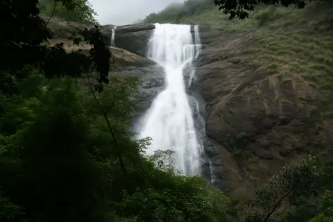 Plan your trip to Palaruvi Waterfalls in Kollam with Karthi Travels® - View 4